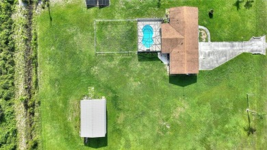 Exceptional Pool Home on 1 Acre in Indian Lake Estates - Golf on Indian Lake Estates Golf and Country Club in Florida - for sale on GolfHomes.com, golf home, golf lot