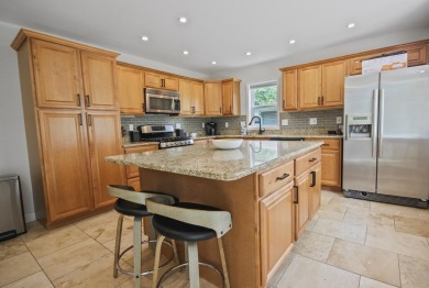 Luxury Living Awaits in This Golf Course Gem!Nestled in the on Lake of Four Seasons Country Club in Indiana - for sale on GolfHomes.com, golf home, golf lot