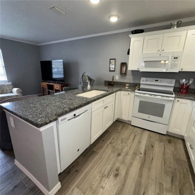 Looking for a completely remodeled home in Gloucester this is on Kings Point Executive Golf Course in Florida - for sale on GolfHomes.com, golf home, golf lot