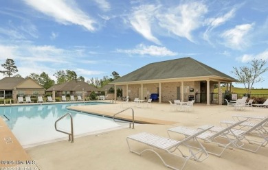 Welcome Home to Westport!  Offered for sale is a pond front home on Cape Fear National At Brunswick Forest in North Carolina - for sale on GolfHomes.com, golf home, golf lot