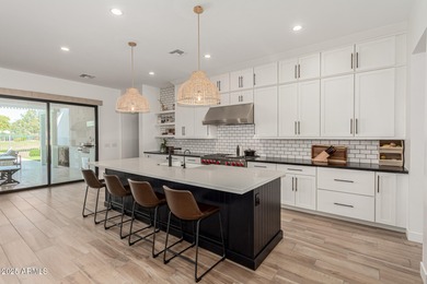 The modern Farmhouse ''St Helena'' model next to the Clubhouse on Sterling Grove Golf & Country Club in Arizona - for sale on GolfHomes.com, golf home, golf lot