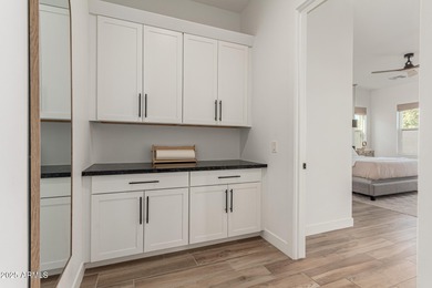 The modern Farmhouse ''St Helena'' model next to the Clubhouse on Sterling Grove Golf & Country Club in Arizona - for sale on GolfHomes.com, golf home, golf lot