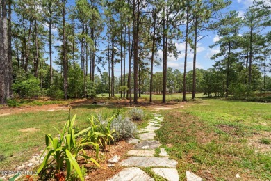 Discover the perfect home at 202 Woodland Circle in Foxfire, NC! on Foxfire Golf and Country Club in North Carolina - for sale on GolfHomes.com, golf home, golf lot