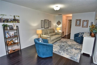 Updated dark floors add drama to the decor in this one bedroom 1 on Pine Lakes Golf Club in Florida - for sale on GolfHomes.com, golf home, golf lot