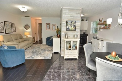 Updated dark floors add drama to the decor in this one bedroom 1 on Pine Lakes Golf Club in Florida - for sale on GolfHomes.com, golf home, golf lot