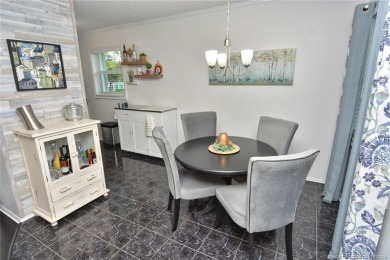 Updated dark floors add drama to the decor in this one bedroom 1 on Pine Lakes Golf Club in Florida - for sale on GolfHomes.com, golf home, golf lot