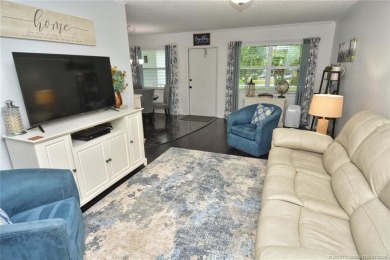 Updated dark floors add drama to the decor in this one bedroom 1 on Pine Lakes Golf Club in Florida - for sale on GolfHomes.com, golf home, golf lot