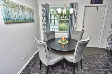 Updated dark floors add drama to the decor in this one bedroom 1 on Pine Lakes Golf Club in Florida - for sale on GolfHomes.com, golf home, golf lot