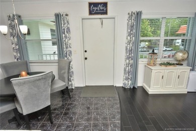 Updated dark floors add drama to the decor in this one bedroom 1 on Pine Lakes Golf Club in Florida - for sale on GolfHomes.com, golf home, golf lot