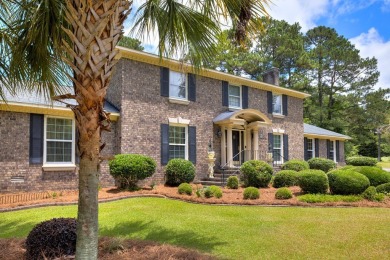 A stately two-story brick residence, exuding timeless elegance on Players Course At Wyboo Plantation in South Carolina - for sale on GolfHomes.com, golf home, golf lot