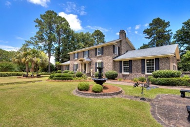 A stately two-story brick residence, exuding timeless elegance on Players Course At Wyboo Plantation in South Carolina - for sale on GolfHomes.com, golf home, golf lot