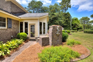 A stately two-story brick residence, exuding timeless elegance on Players Course At Wyboo Plantation in South Carolina - for sale on GolfHomes.com, golf home, golf lot