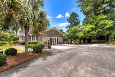 A stately two-story brick residence, exuding timeless elegance on Players Course At Wyboo Plantation in South Carolina - for sale on GolfHomes.com, golf home, golf lot