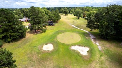 A stately two-story brick residence, exuding timeless elegance on Players Course At Wyboo Plantation in South Carolina - for sale on GolfHomes.com, golf home, golf lot