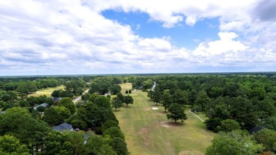 A stately two-story brick residence, exuding timeless elegance on Players Course At Wyboo Plantation in South Carolina - for sale on GolfHomes.com, golf home, golf lot