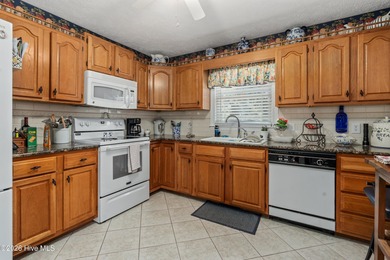 Welcome to 912 Rivage Promenade, a beautifully maintained on Beau Rivage Golf and Resort in North Carolina - for sale on GolfHomes.com, golf home, golf lot