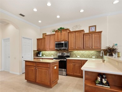 This wonderful 3-bedroom home with SPACIOUS BONUS ROOM, HEATED on Pelican Pointe Golf and Country Club in Florida - for sale on GolfHomes.com, golf home, golf lot