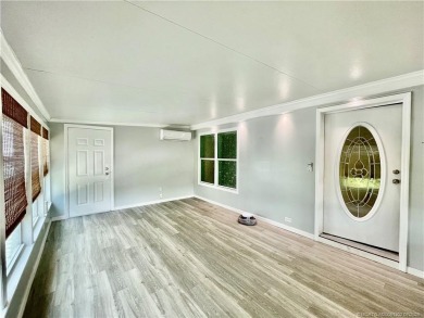 This home truly has it all! 3 bedrooms/2 bath + bonus room on Indianwood Golf and Country Club in Florida - for sale on GolfHomes.com, golf home, golf lot