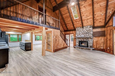 Situated on the golf course in Tanglwood Lakes, this stunning on Paupack Hills Golf and Country Club in Pennsylvania - for sale on GolfHomes.com, golf home, golf lot