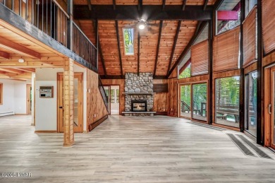 Situated on the golf course in Tanglwood Lakes, this stunning on Paupack Hills Golf and Country Club in Pennsylvania - for sale on GolfHomes.com, golf home, golf lot
