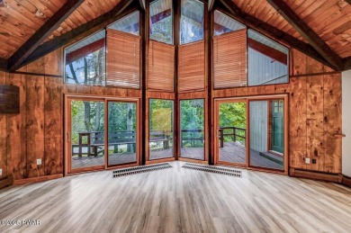 Situated on the golf course in Tanglwood Lakes, this stunning on Paupack Hills Golf and Country Club in Pennsylvania - for sale on GolfHomes.com, golf home, golf lot