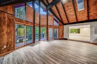 Situated on the golf course in Tanglwood Lakes, this stunning on Paupack Hills Golf and Country Club in Pennsylvania - for sale on GolfHomes.com, golf home, golf lot