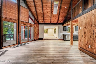 Situated on the golf course in Tanglwood Lakes, this stunning on Paupack Hills Golf and Country Club in Pennsylvania - for sale on GolfHomes.com, golf home, golf lot
