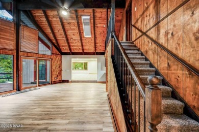 Situated on the golf course in Tanglwood Lakes, this stunning on Paupack Hills Golf and Country Club in Pennsylvania - for sale on GolfHomes.com, golf home, golf lot
