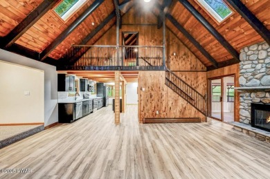 Situated on the golf course in Tanglwood Lakes, this stunning on Paupack Hills Golf and Country Club in Pennsylvania - for sale on GolfHomes.com, golf home, golf lot