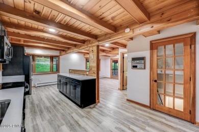 Situated on the golf course in Tanglwood Lakes, this stunning on Paupack Hills Golf and Country Club in Pennsylvania - for sale on GolfHomes.com, golf home, golf lot