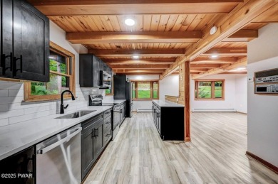Situated on the golf course in Tanglwood Lakes, this stunning on Paupack Hills Golf and Country Club in Pennsylvania - for sale on GolfHomes.com, golf home, golf lot