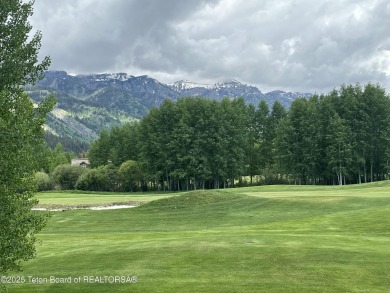 Bordering the 11th fairway of the prestigious Teton Pines golf on Teton Pines Golf Club in Wyoming - for sale on GolfHomes.com, golf home, golf lot