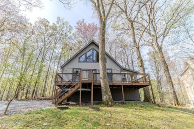 Tucked away in the serene heart of the Lake Wallenpaupack region on Paupack Hills Golf and Country Club in Pennsylvania - for sale on GolfHomes.com, golf home, golf lot