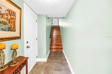 Welcome to coastal living in Treasure Island, a true Norman on Treasure Bay Golf and Tennis in Florida - for sale on GolfHomes.com, golf home, golf lot