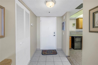 Move-in ready and fully furnished, this spacious 2-bed, 2-bath on Isla Del Sol Yacht and Country Club in Florida - for sale on GolfHomes.com, golf home, golf lot