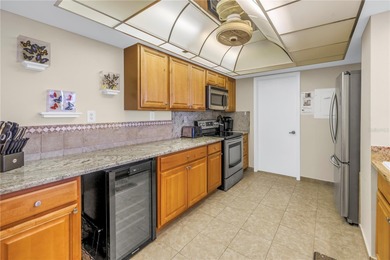 Move-in ready and fully furnished, this spacious 2-bed, 2-bath on Isla Del Sol Yacht and Country Club in Florida - for sale on GolfHomes.com, golf home, golf lot