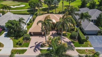 Beautifully appointed, welcoming home with split bedrooms and on Bocaire Country Club in Florida - for sale on GolfHomes.com, golf home, golf lot