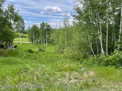This is a golf side forest cabin lot on Blackfoot Trail on Teton Springs Resort and Club in Idaho - for sale on GolfHomes.com, golf home, golf lot