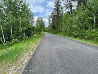 This is a golf side forest cabin lot on Blackfoot Trail on Teton Springs Resort and Club in Idaho - for sale on GolfHomes.com, golf home, golf lot