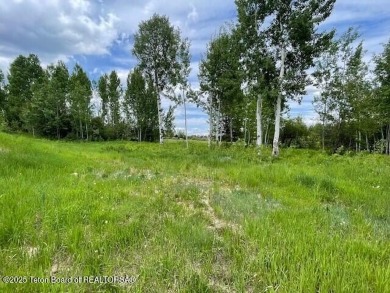 This is a golf side forest cabin lot on Blackfoot Trail on Teton Springs Resort and Club in Idaho - for sale on GolfHomes.com, golf home, golf lot