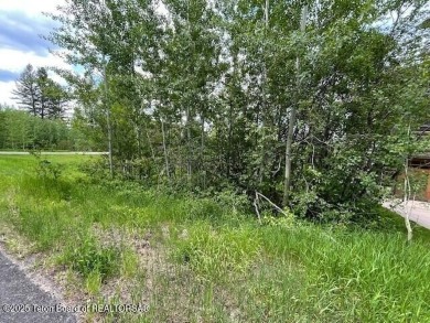 This is a golf side forest cabin lot on Blackfoot Trail on Teton Springs Resort and Club in Idaho - for sale on GolfHomes.com, golf home, golf lot