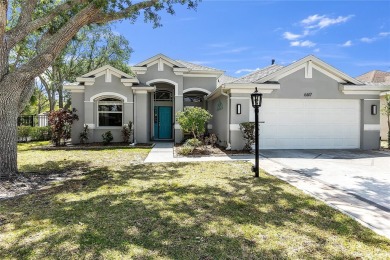 Wake up to breathtaking sunrises over the water from the comfort on University Park Country Club in Florida - for sale on GolfHomes.com, golf home, golf lot