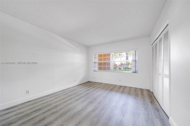 Excellent unit overlooking the golf course and lake on Palm-Aire Country Club and Resort - The Oaks in Florida - for sale on GolfHomes.com, golf home, golf lot