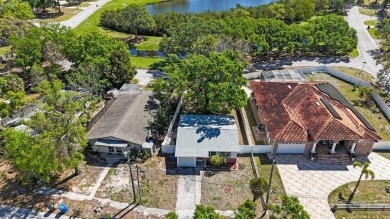 One or more photo(s) has been virtually staged. Charming on Mangrove Bay Golf Course in Florida - for sale on GolfHomes.com, golf home, golf lot