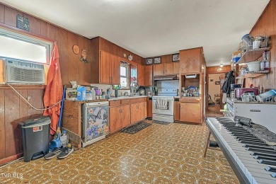 Great investment property/fixer upper with plenty of outdoor on The Crossings Golf Club in Tennessee - for sale on GolfHomes.com, golf home, golf lot