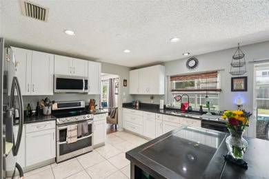 Tucked away in Windmill Pointe of Tarpon Lake, this tastefully on Lansbrook Golf Club in Florida - for sale on GolfHomes.com, golf home, golf lot