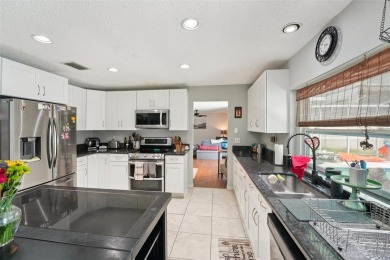 Tucked away in Windmill Pointe of Tarpon Lake, this tastefully on Lansbrook Golf Club in Florida - for sale on GolfHomes.com, golf home, golf lot