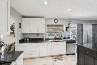 Tucked away in Windmill Pointe of Tarpon Lake, this tastefully on Lansbrook Golf Club in Florida - for sale on GolfHomes.com, golf home, golf lot