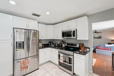 Tucked away in Windmill Pointe of Tarpon Lake, this tastefully on Lansbrook Golf Club in Florida - for sale on GolfHomes.com, golf home, golf lot
