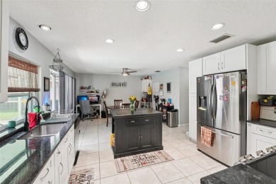 Tucked away in Windmill Pointe of Tarpon Lake, this tastefully on Lansbrook Golf Club in Florida - for sale on GolfHomes.com, golf home, golf lot
